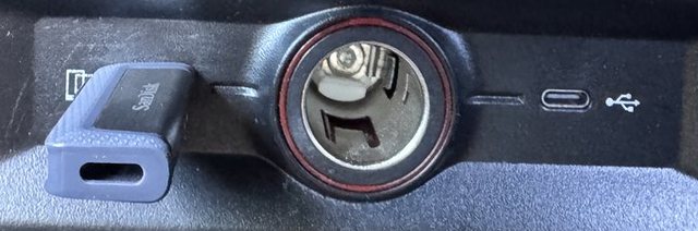 The centre-console USB-A port with a drive in it